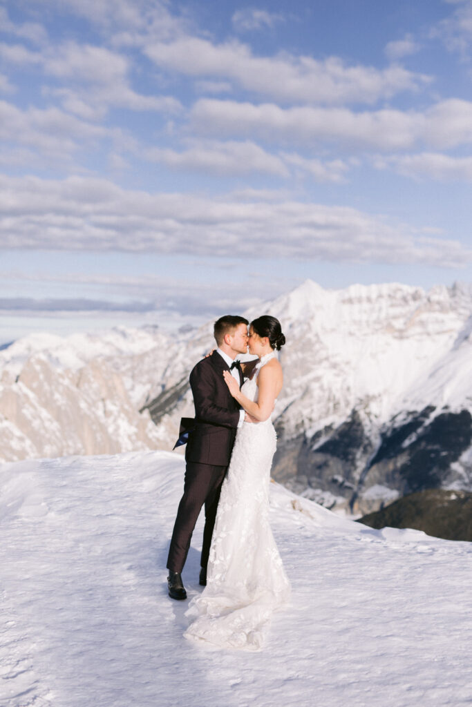 bridal couple in the snowy mountains; Austria-Alpine-Wedding-Planner